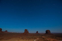 ￼ Monument Valley Under the Stars Still no LakeshoreImages website so I may start adding more photos here.  I did get up to the Monument Valley Overlook/Parking Lot a little after dusk.  I took a series of photos, most at ISO 1600, f:2.8 & 8 to 15 seconds.  There was enough moonlight to show the formations, yet allowed enough of the stars to show to make it interesting.  It would have been better if there was a power blackout - the parking lot has lots of lights.  There are a few images with lights from returning cars, and airplanes, but overall it worked OK.  I washed the trailer & RAV4 on the way out of Gouldings Camp Park.  The water spray didn't remove everything; the bugs need an actual scrubbing, but at least the first layer of red dust is gone.  It was a short drive to Blanding, UT & the Blue Mountain RV Park.  I'm in site 8, a shaded back in that just fits the trailer & RAV4. After setting up I plan to drive out to the location for the trail to House on Fire.  It is too late in the day to properly photograph it - I'll do that tomorrow.  I did drive out to the trail head, and also stopped at the "Official" Mule Canyon Ruin Exhibit, about 1/2 mile west of Arch Canyon road, the entrance to the trail head. Laurent Martres, who's 3 books "Photographing the Southwest" have been my guide to many locations feels that the exhibit was built to keep down traffic in the canyon.  I'll have to agree with him - it is far to new looking to be realistic.  ￼ Mule Canyon Ruin Exhibit   ￼ Mule Canyon Ruin Exhibit After that it was back to the campground by way of the local grocery store & some barbecued chicken for dinner.  Until Tomorrow - Monument Valley