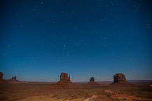 ￼ Monument Valley Under the Stars Still no LakeshoreImages website so I may start adding more photos here.  I did get up to the Monument Valley Overlook/Parking Lot a little after dusk.  I took a series of photos, most at ISO 1600, f:2.8 & 8 to 15 seconds.  There was enough moonlight to show the formations, yet allowed enough of the stars to show to make it interesting.  It would have been better if there was a power blackout - the parking lot has lots of lights.  There are a few images with lights from returning cars, and airplanes, but overall it worked OK.  I washed the trailer & RAV4 on the way out of Gouldings Camp Park.  The water spray didn't remove everything; the bugs need an actual scrubbing, but at least the first layer of red dust is gone.  It was a short drive to Blanding, UT & the Blue Mountain RV Park.  I'm in site 8, a shaded back in that just fits the trailer & RAV4. After setting up I plan to drive out to the location for the trail to House on Fire.  It is too late in the day to properly photograph it - I'll do that tomorrow.  I did drive out to the trail head, and also stopped at the "Official" Mule Canyon Ruin Exhibit, about 1/2 mile west of Arch Canyon road, the entrance to the trail head. Laurent Martres, who's 3 books "Photographing the Southwest" have been my guide to many locations feels that the exhibit was built to keep down traffic in the canyon.  I'll have to agree with him - it is far to new looking to be realistic.  ￼ Mule Canyon Ruin Exhibit   ￼ Mule Canyon Ruin Exhibit After that it was back to the campground by way of the local grocery store & some barbecued chicken for dinner.  Until Tomorrow - Monument Valley