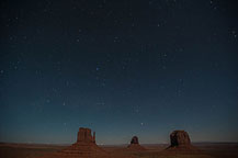￼ Monument Valley Under the Stars Still no LakeshoreImages website so I may start adding more photos here.  I did get up to the Monument Valley Overlook/Parking Lot a little after dusk.  I took a series of photos, most at ISO 1600, f:2.8 & 8 to 15 seconds.  There was enough moonlight to show the formations, yet allowed enough of the stars to show to make it interesting.  It would have been better if there was a power blackout - the parking lot has lots of lights.  There are a few images with lights from returning cars, and airplanes, but overall it worked OK.  I washed the trailer & RAV4 on the way out of Gouldings Camp Park.  The water spray didn't remove everything; the bugs need an actual scrubbing, but at least the first layer of red dust is gone.  It was a short drive to Blanding, UT & the Blue Mountain RV Park.  I'm in site 8, a shaded back in that just fits the trailer & RAV4. After setting up I plan to drive out to the location for the trail to House on Fire.  It is too late in the day to properly photograph it - I'll do that tomorrow.  I did drive out to the trail head, and also stopped at the "Official" Mule Canyon Ruin Exhibit, about 1/2 mile west of Arch Canyon road, the entrance to the trail head. Laurent Martres, who's 3 books "Photographing the Southwest" have been my guide to many locations feels that the exhibit was built to keep down traffic in the canyon.  I'll have to agree with him - it is far to new looking to be realistic.  ￼ Mule Canyon Ruin Exhibit   ￼ Mule Canyon Ruin Exhibit After that it was back to the campground by way of the local grocery store & some barbecued chicken for dinner.  Until Tomorrow - Monument Valley